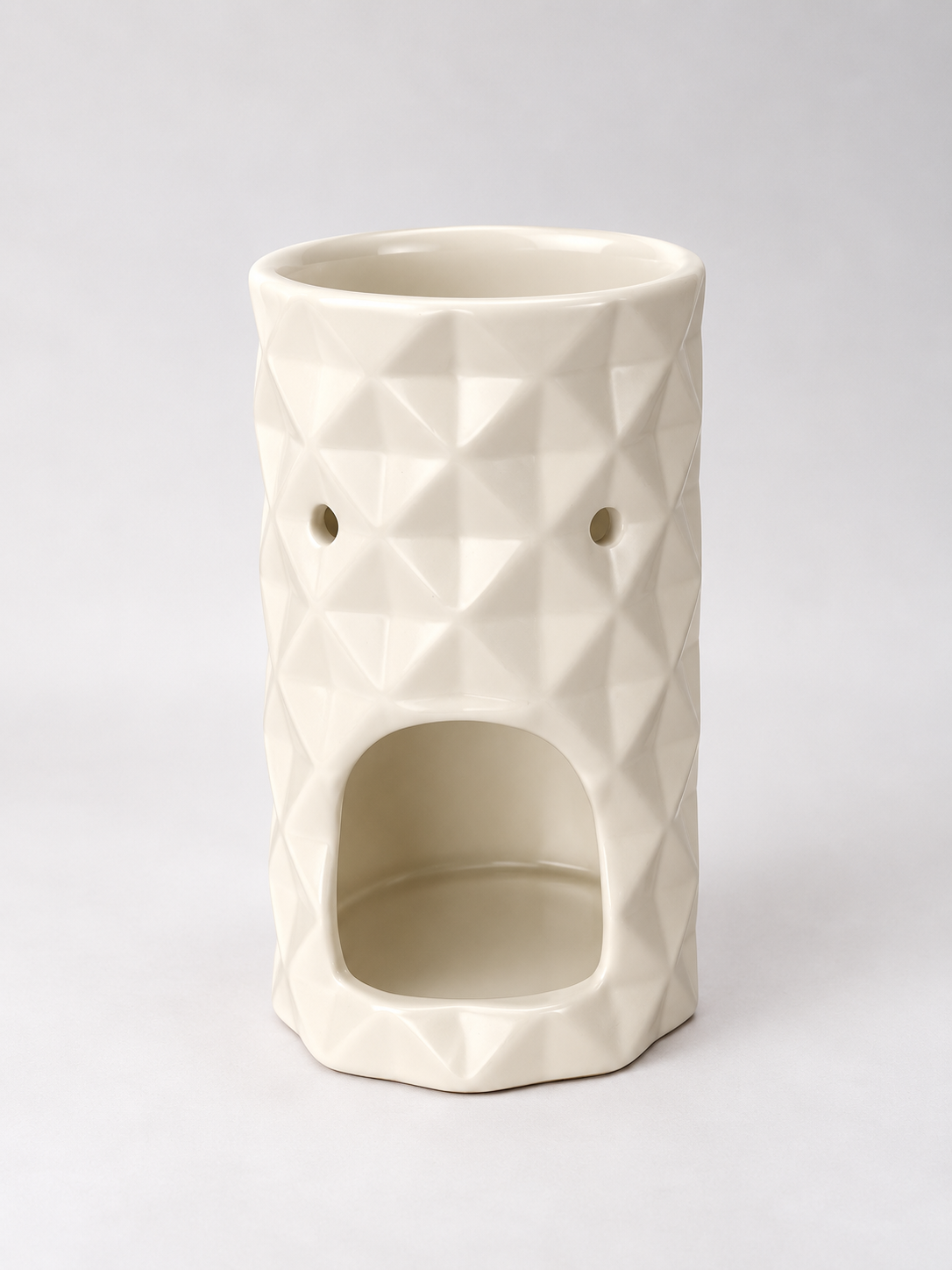 Vista trasera del quemador de cera Origami con la abertura para colocar la vela de té