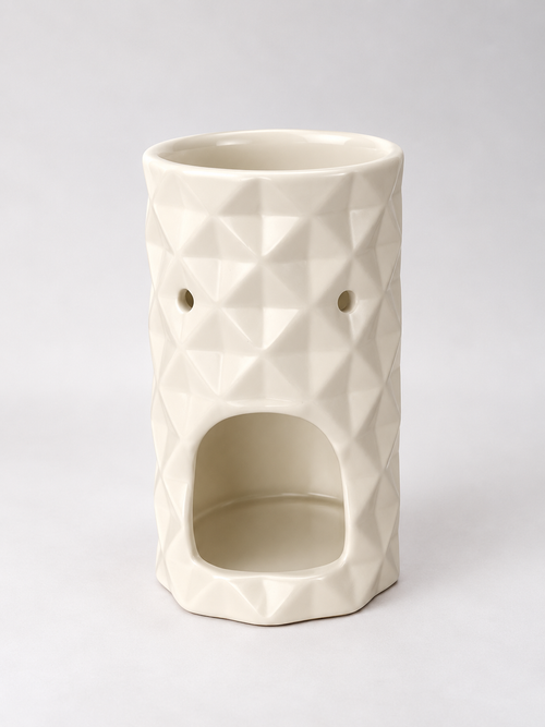 Vista trasera del quemador de cera Origami con la abertura para colocar la vela de té